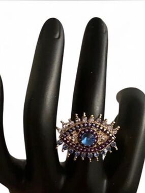 Elegant Blue Eye Ring with Gold Detailing